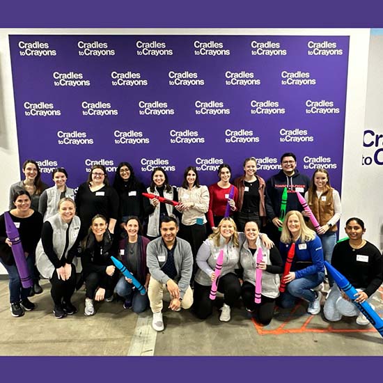 pri-med employees volunteering at cradles to crayons