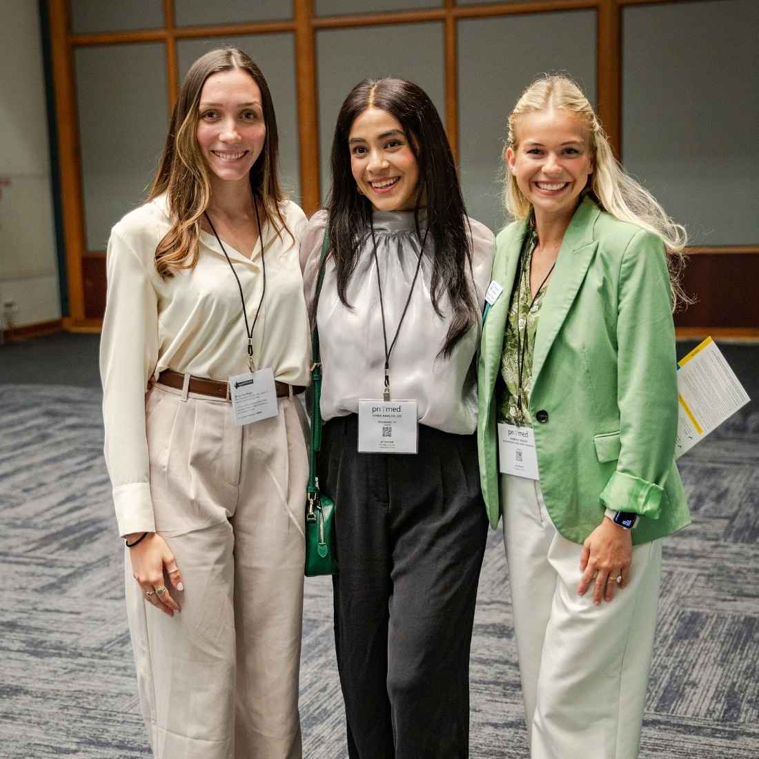 attendees smiling at pri-med conference