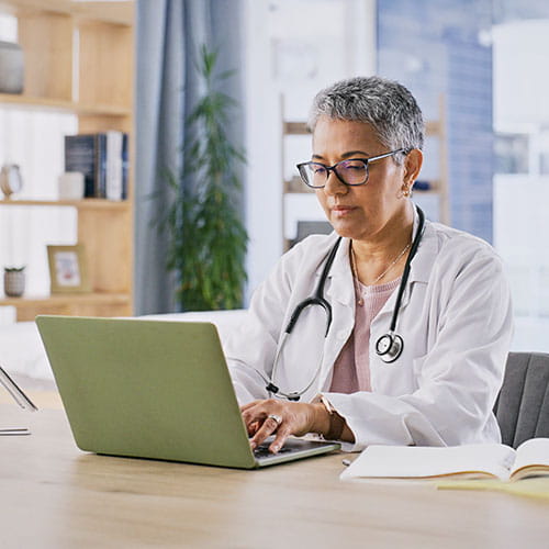 doctor working on a computer