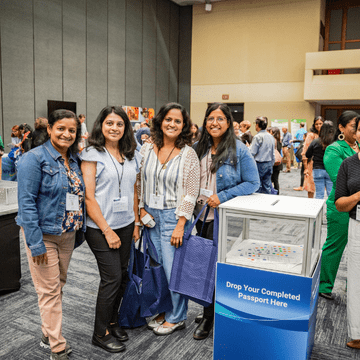 Colleagues exploring the Product Forum at a regional conference. 